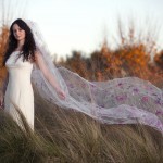 A romantic handpainted veil of pink roses, a perfect addition to a sophisticated Giorgio Armani wedding gown